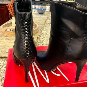 Women’s black and silver above the ankle bootie